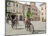 Cyclists Riding Through Namesti in Town of Mikulov, Brnensko Region-Richard Nebesky-Mounted Photographic Print