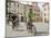 Cyclists Riding Through Namesti in Town of Mikulov, Brnensko Region-Richard Nebesky-Mounted Photographic Print