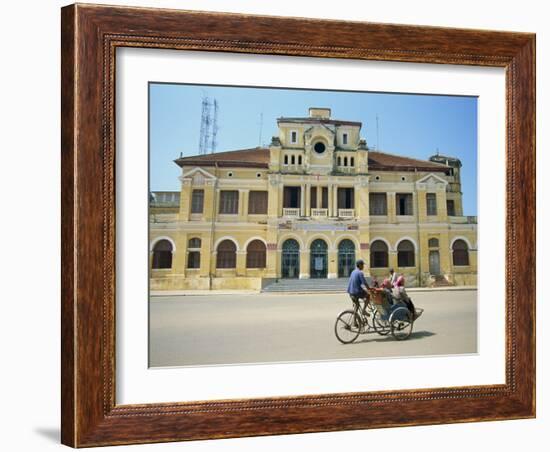 Cyclo Passing the Old Post Office in Phnom Penh in Cambodia, Indochina, Southeast Asia-Tim Hall-Framed Photographic Print