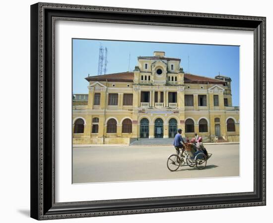 Cyclo Passing the Old Post Office in Phnom Penh in Cambodia, Indochina, Southeast Asia-Tim Hall-Framed Photographic Print