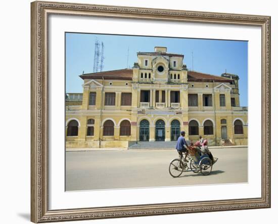 Cyclo Passing the Old Post Office in Phnom Penh in Cambodia, Indochina, Southeast Asia-Tim Hall-Framed Photographic Print