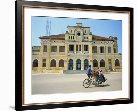 Cyclo Passing the Old Post Office in Phnom Penh in Cambodia, Indochina, Southeast Asia-Tim Hall-Framed Photographic Print