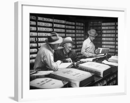 D. N. Pogue and Charles Stimson Visiting County Clerk's Office to Peruse Real Estate Records-null-Framed Photographic Print