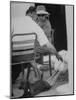 Dachshund Ignoring Pelican's Teasing-James Burke-Mounted Photographic Print