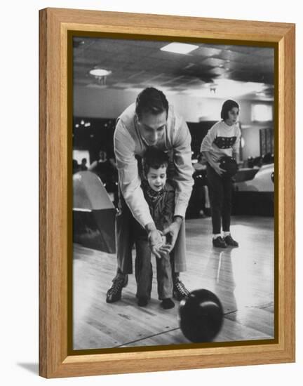 Dad Showing 3 Year Old Daughter the Basics of Bowling-George Silk-Framed Premier Image Canvas