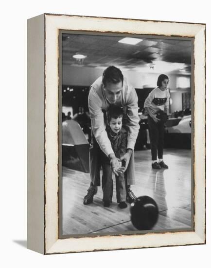 Dad Showing 3 Year Old Daughter the Basics of Bowling-George Silk-Framed Premier Image Canvas