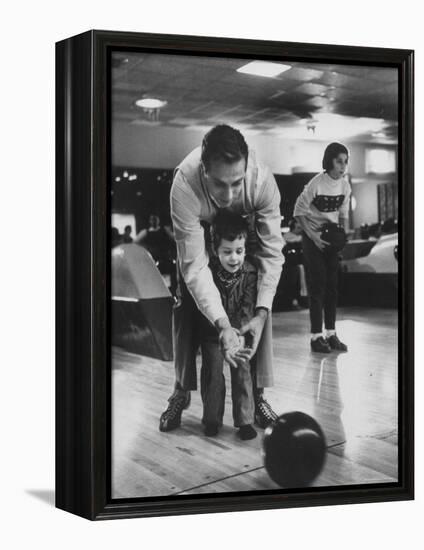 Dad Showing 3 Year Old Daughter the Basics of Bowling-George Silk-Framed Premier Image Canvas