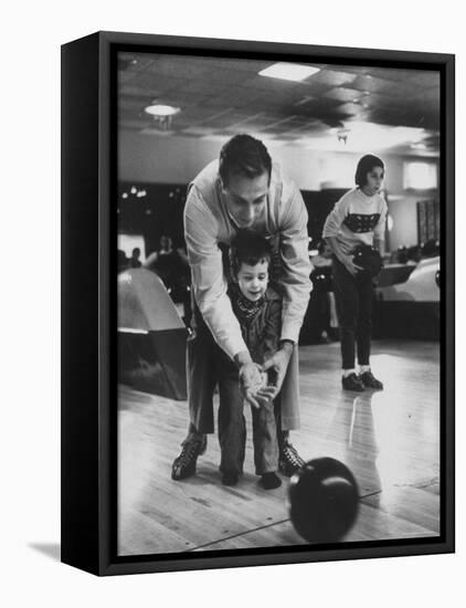 Dad Showing 3 Year Old Daughter the Basics of Bowling-George Silk-Framed Premier Image Canvas