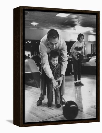 Dad Showing 3 Year Old Daughter the Basics of Bowling-George Silk-Framed Premier Image Canvas