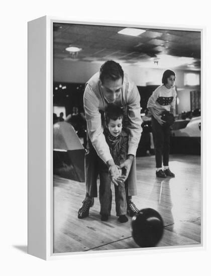 Dad Showing 3 Year Old Daughter the Basics of Bowling-George Silk-Framed Premier Image Canvas