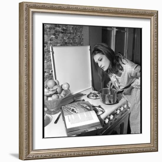 Dalida Ccooking in Her Kitchen-Marcel Begoin-Framed Photographic Print