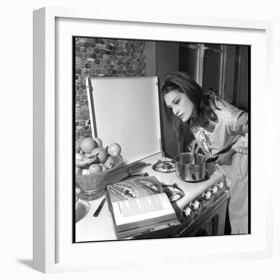 Dalida Ccooking in Her Kitchen-Marcel Begoin-Framed Photographic Print