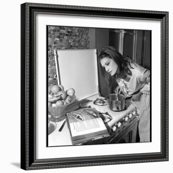 Dalida Ccooking in Her Kitchen-Marcel Begoin-Framed Photographic Print