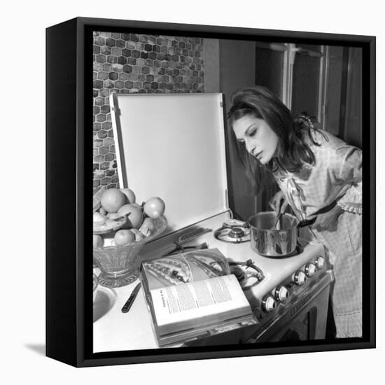 Dalida Ccooking in Her Kitchen-Marcel Begoin-Framed Premier Image Canvas