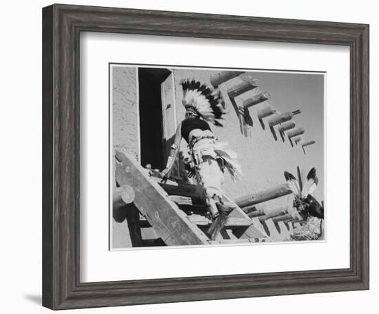 Dance San Ildefonso Pueblo New Mexico 1942 Two Indians In Headdress Ascending Stairs To House 1942-Ansel Adams-Framed Art Print