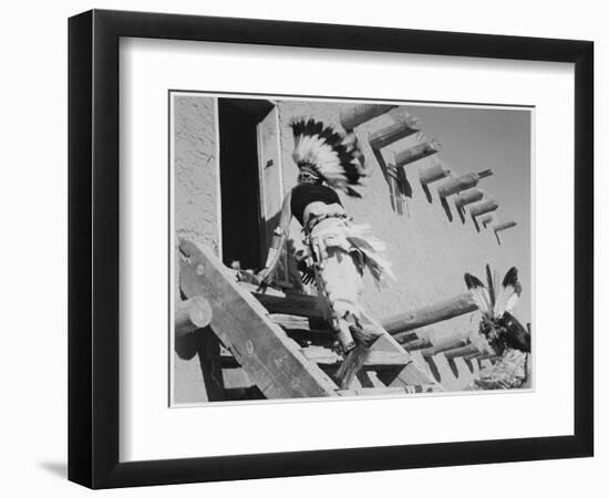 Dance San Ildefonso Pueblo New Mexico 1942 Two Indians In Headdress Ascending Stairs To House 1942-Ansel Adams-Framed Art Print