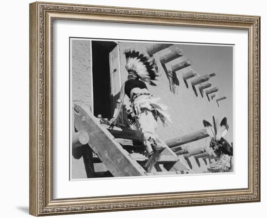 Dance San Ildefonso Pueblo New Mexico 1942 Two Indians In Headdress Ascending Stairs To House 1942-Ansel Adams-Framed Art Print