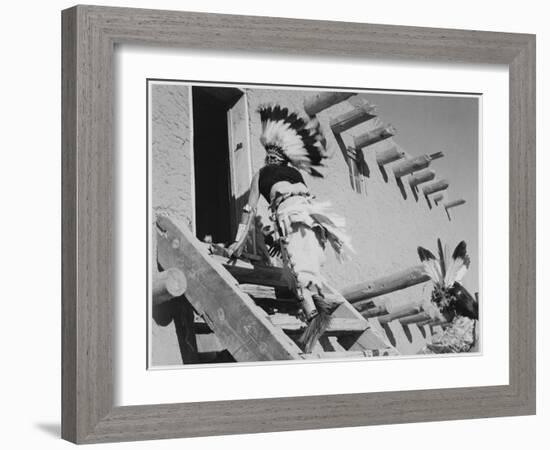 Dance San Ildefonso Pueblo New Mexico 1942 Two Indians In Headdress Ascending Stairs To House 1942-Ansel Adams-Framed Art Print