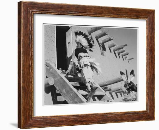 Dance San Ildefonso Pueblo New Mexico 1942 Two Indians In Headdress Ascending Stairs To House 1942-Ansel Adams-Framed Art Print