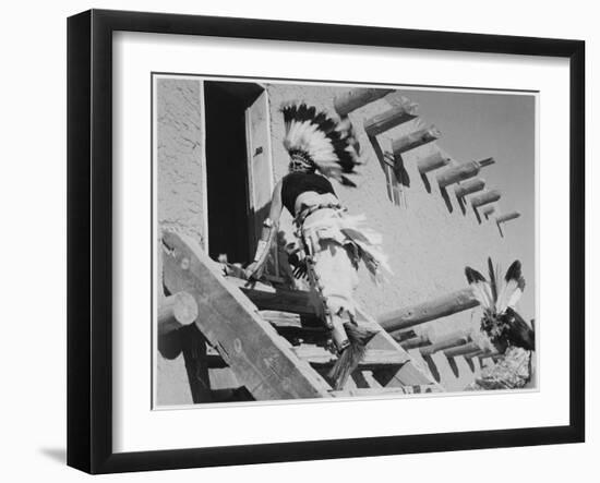 Dance San Ildefonso Pueblo New Mexico 1942 Two Indians In Headdress Ascending Stairs To House 1942-Ansel Adams-Framed Art Print