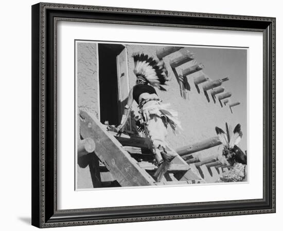 Dance San Ildefonso Pueblo New Mexico 1942 Two Indians In Headdress Ascending Stairs To House 1942-Ansel Adams-Framed Art Print