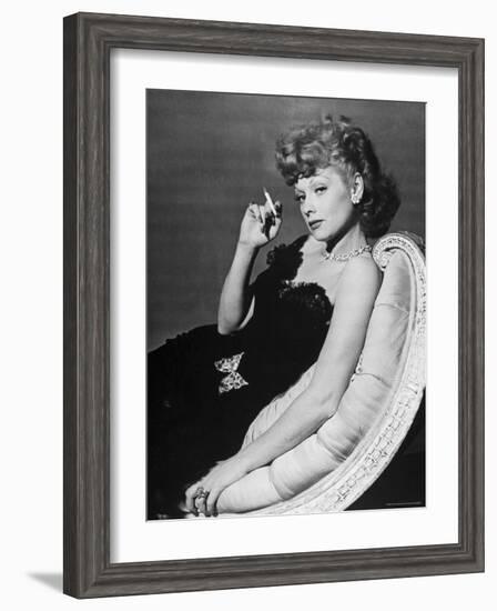 Dancer/Actress Lucille Ball in Strapless Black Lace Evening Dress, Holding Lit Cigarette on Couch-John Florea-Framed Premium Photographic Print