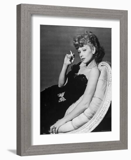 Dancer/Actress Lucille Ball in Strapless Black Lace Evening Dress, Holding Lit Cigarette on Couch-John Florea-Framed Premium Photographic Print