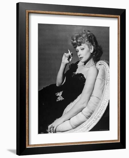 Dancer/Actress Lucille Ball in Strapless Black Lace Evening Dress, Holding Lit Cigarette on Couch-John Florea-Framed Premium Photographic Print