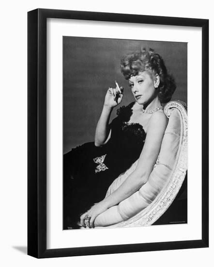 Dancer/Actress Lucille Ball in Strapless Black Lace Evening Dress, Holding Lit Cigarette on Couch-John Florea-Framed Premium Photographic Print