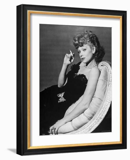 Dancer/Actress Lucille Ball in Strapless Black Lace Evening Dress, Holding Lit Cigarette on Couch-John Florea-Framed Premium Photographic Print