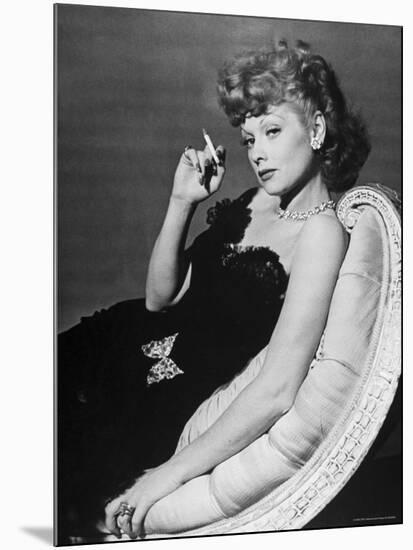 Dancer/Actress Lucille Ball in Strapless Black Lace Evening Dress, Holding Lit Cigarette on Couch-John Florea-Mounted Premium Photographic Print