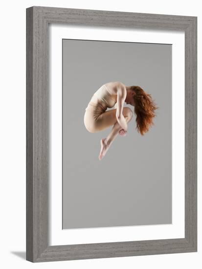Dancer in Mid-Air with Arms around Knees-null-Framed Photo