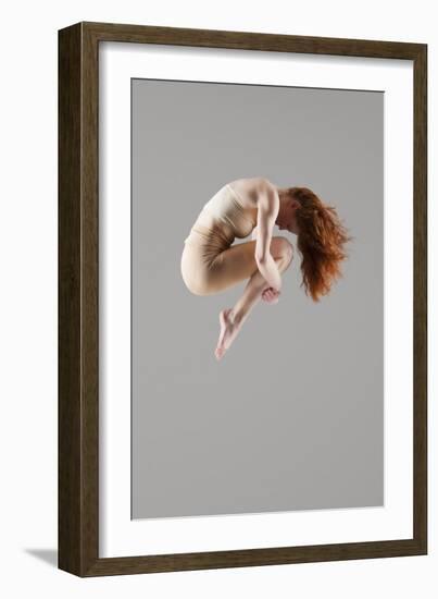 Dancer in Mid-Air with Arms around Knees-null-Framed Photo