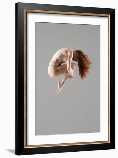 Dancer in Mid-Air with Arms around Knees-null-Framed Photo