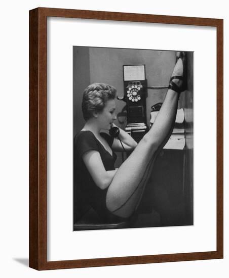 Dancer Mary Ellen Terry Talking with Her Legs Up in Telephone Booth-Gordon Parks-Framed Premium Photographic Print