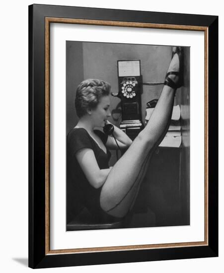 Dancer Mary Ellen Terry Talking with Her Legs Up in Telephone Booth-Gordon Parks-Framed Premium Photographic Print