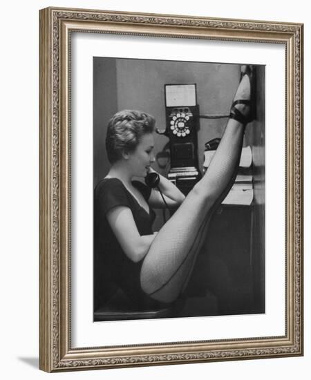 Dancer Mary Ellen Terry Talking with Her Legs Up in Telephone Booth-Gordon Parks-Framed Photographic Print