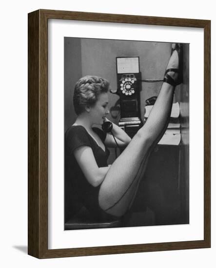 Dancer Mary Ellen Terry Talking with Her Legs Up in Telephone Booth-Gordon Parks-Framed Photographic Print