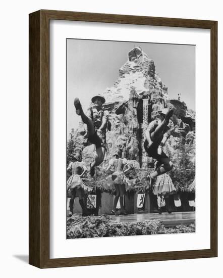 Dancers Do Matterhorn Act in Front of Artificial Slope at Disneyland-Ralph Crane-Framed Photographic Print