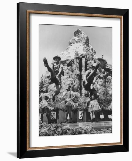 Dancers Do Matterhorn Act in Front of Artificial Slope at Disneyland-Ralph Crane-Framed Photographic Print