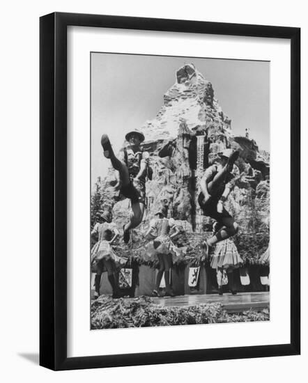 Dancers Do Matterhorn Act in Front of Artificial Slope at Disneyland-Ralph Crane-Framed Photographic Print