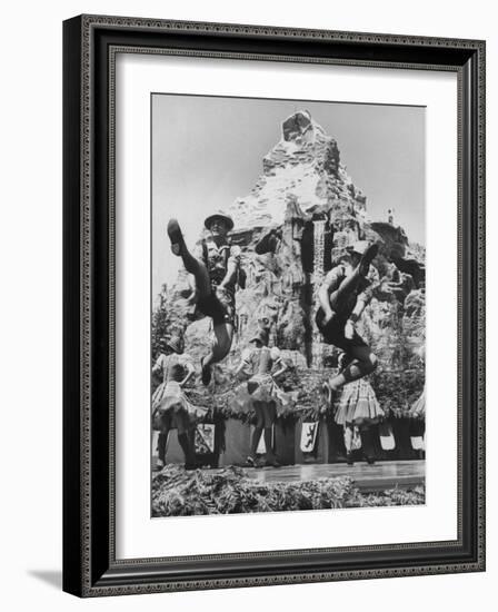 Dancers Do Matterhorn Act in Front of Artificial Slope at Disneyland-Ralph Crane-Framed Photographic Print