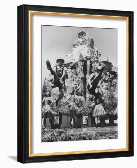 Dancers Do Matterhorn Act in Front of Artificial Slope at Disneyland-Ralph Crane-Framed Photographic Print