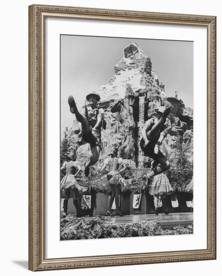 Dancers Do Matterhorn Act in Front of Artificial Slope at Disneyland-Ralph Crane-Framed Photographic Print