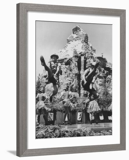 Dancers Do Matterhorn Act in Front of Artificial Slope at Disneyland-Ralph Crane-Framed Photographic Print