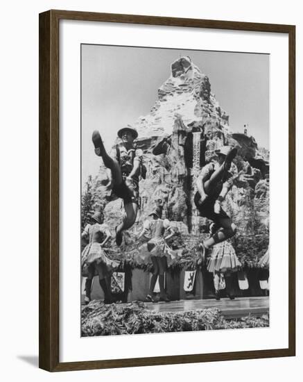 Dancers Do Matterhorn Act in Front of Artificial Slope at Disneyland-Ralph Crane-Framed Photographic Print