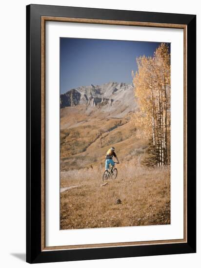 Dane Cronin Rides Through Telluride Ski Resort, San Juan Mts Loom On Horizon. Telluride, Colorado-Dan Holz-Framed Photographic Print