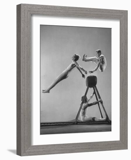 Danish Gymnasts Erik Hansen Followed by John Thomsen Do High Thief Jump as Team Member Braces Buck-Gjon Mili-Framed Photographic Print