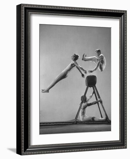 Danish Gymnasts Erik Hansen Followed by John Thomsen Do High Thief Jump as Team Member Braces Buck-Gjon Mili-Framed Photographic Print