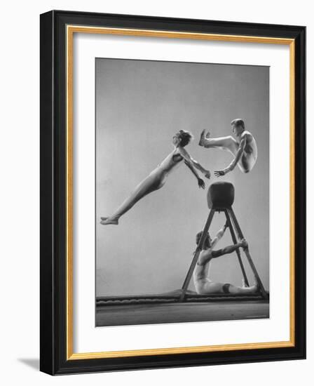 Danish Gymnasts Erik Hansen Followed by John Thomsen Do High Thief Jump as Team Member Braces Buck-Gjon Mili-Framed Photographic Print